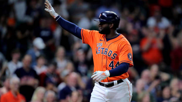 Astros hitter Yordan Alvarez salutes the Houston crowd after hitting a home run.